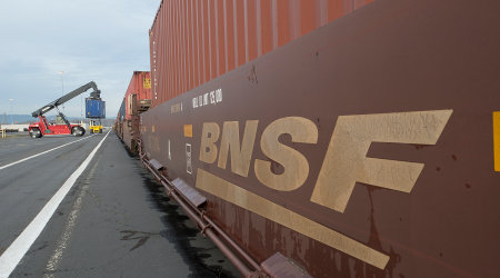BNSF Rail Car loading containers for intermodal shipment.