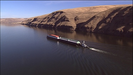 (Idaho Public Television) Barges take goods from Idaho's Port of Lewiston to the Pacific Ocean. Sediment is building up behind the lower Snake River's Lower Granite Dam, making travel more difficult.