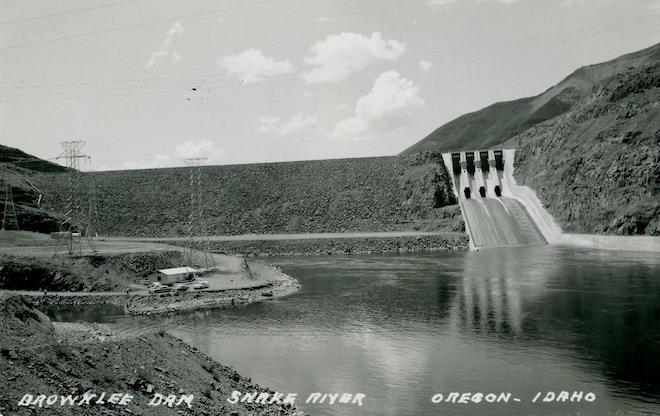 This historical photo of Brownlee Dam used as a postcard dates from around 1960.