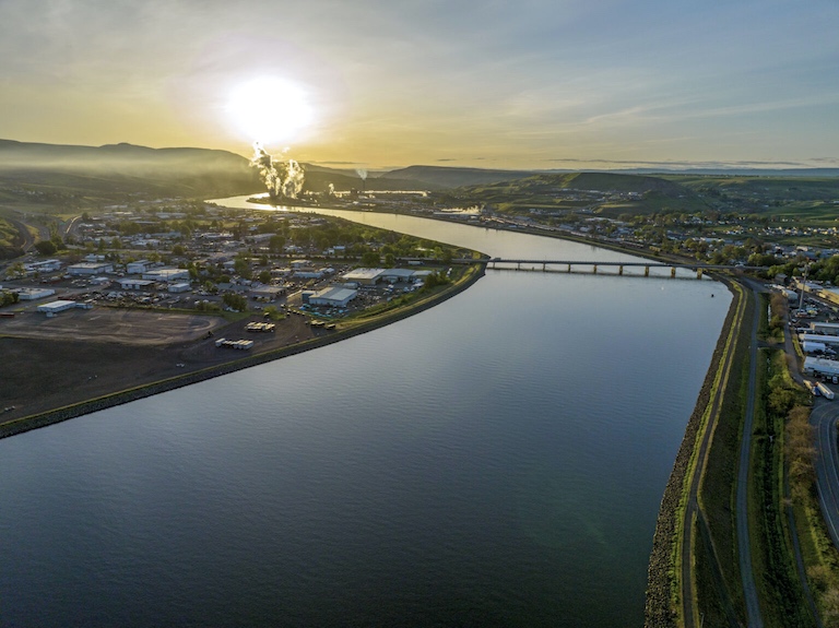 Looking eastward at sunrise from above the Clearwater River and Lewis & Clark grain terminal just out of view at right of frame. (Courtesy of Visit Idaho)