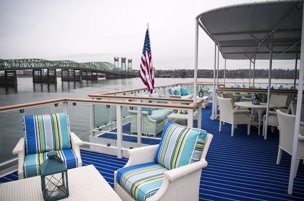 The third-floor “back porch” deck on the American Song offers views from the stern of the ship. The Interstate 5 Bridge takes center stage while the ship is docked at the Red Lion Hotel at Jantzen Beach. Alisha Jucevic/The Columbian