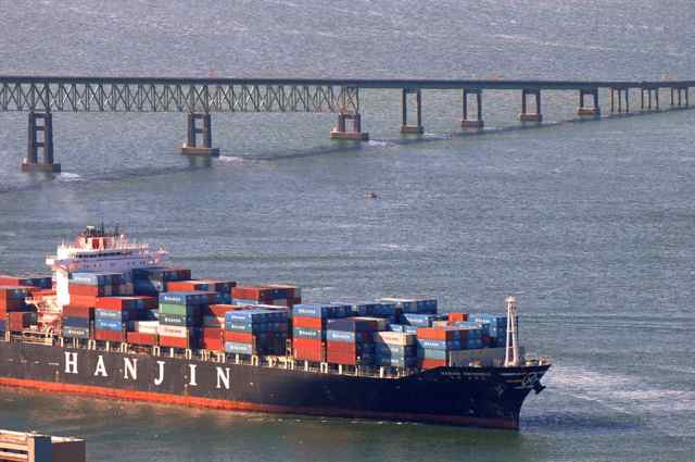 A fully loaded Hanjin freighter passed underneath the Astoria-Megler Bridge. The Port of Portland lost nearly 80 percent of its container traffic Feb. 12, 2015, when the world's ninth-largest shipping line, Hanjin, decided to withdraw amid labor strife.(Mark Graves photo)