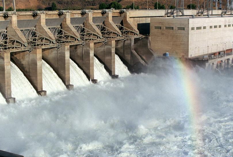 A rainbow shines in the cascading water at Ice Harbor Dam on the Snake River. (File / The Spokesman-Review)