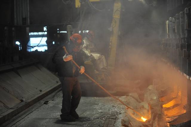 Workers start aluminum smelter pots on potline B at the Alcoa Intalco aluminum smelter west of Ferndale on Feb. 15, 2011. Though Alcoa plans to idle the plant June 30, 2016, the company is hiring temporary workers to help ensure the facility is adequately staffed.  (Philip A. Dwyer photo)
