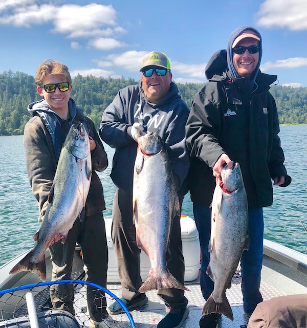 Dennis Schwartz (center) and friends got into a pretty nice grade of Lower Columbia Chinook earlier today. (Knife Photo Contest)