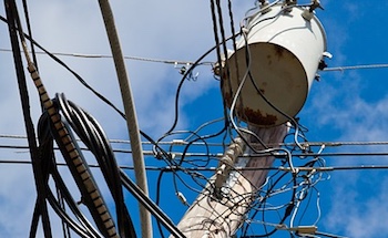 Power pole transformers, where voltage is stepped down for residential use, is a substantial source of line loss.