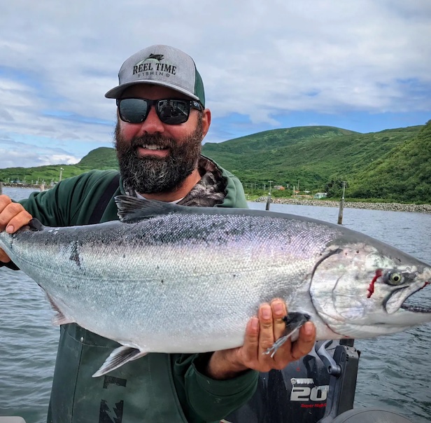 Chinook Salmon in hand of Steve Windt, fishing guide with Reel Time Fishing.