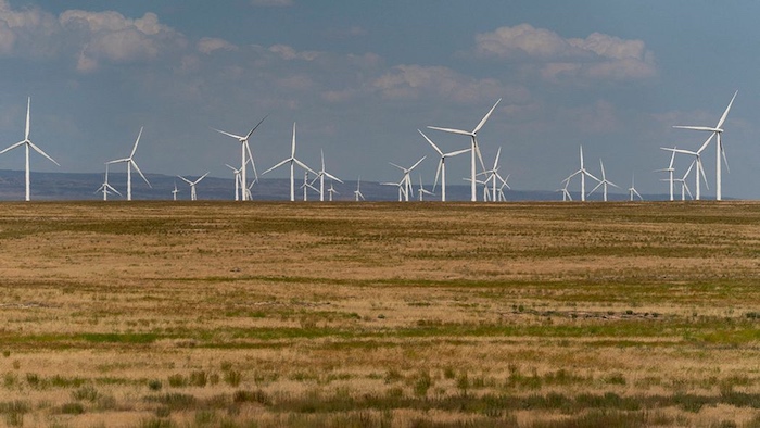 Wind turbines are seen from Interstate-84, Sunday, July 9, 2023, near Hammett, Idaho. The Lava Ridge wind farm project, proposed by Magic Valley Energy, would place up to 400 wind turbines up to 740 feet tall within the view of Minidoka National Historic Site. (AP Photo/Lindsey Wasson)