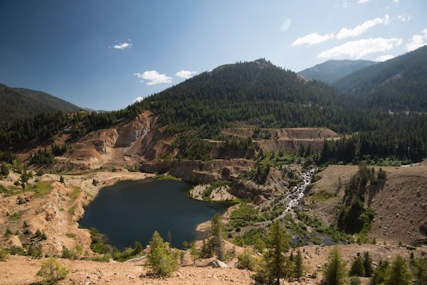 The Yellow Pine pit blocks natural passage of the East Fork of the South Fork of the Salmon River, a barrier to Chinook reaching their historic spawning grounds. It's also a source of heavy metal leaching into the river. (Midas Gold photo)