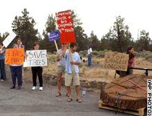 A group of anti-logging protesters in Redmond, Oregon waited for President Bush to pass by on Thursday.