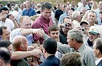 (Ken Lambert) President Bush, lower right, shakes hands at the Ice Harbor Lock and Dam in Walla Walla County yesterday after making it clear that the structure would not be removed.