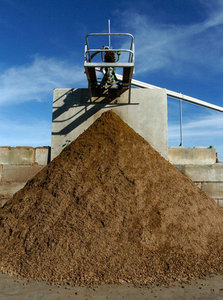 (Pete Kendall/The Bellingham Herald) Digested fiber, with the consistency of peat moss, is a byproduct of an aneraboci digester on Darryl Vander Haak's dairy farm near Lynden in this 2005 photo. A Skagit County company plans to build Whatcom County's second digester on another farm near Lynden.