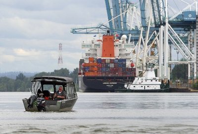 (Mark Harrison photo) Salmon fishing in sight of a busy container terminal.