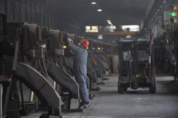 (Philip A. Dwyer) Workers start aluminum smelter pots on potline B at the Alcoa Intalco aluminum smelter west of Ferndale, Tuesday afternoon, Feb. 15, 2011. Intalco has also hired 60 more people.
