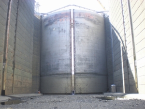 (Army Corps of Engineers) Workers walk near the The Dalles downstream gate during last year's outage. The lock will be closed from Dec. 10 to March 18 to replace the two downstream miter gates.