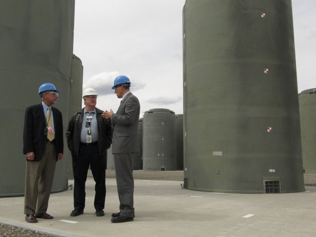 Energy Northwest CEO Vic Parrish, center, shows U.S. Reps. Doc Hastings, left, and Jay Inslee containers holding spent nuclear fuel from the Northwest's only commercial nuclear plant Friday in Richland.