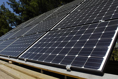 (Andy Lavalley/The Post-Trubune) Some of the twenty 3 by 5 foot solar panels recently installed by Rich Herr at his home in Valparaiso, Ind. Solar power could disrupt the business model of traditional utility companies.