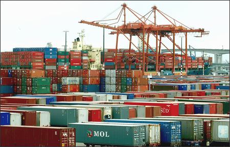 A ship waits to be unloaded at the Port of Seattle's Terminal 5, which is filled with other containers destined to be sent off by rail or loaded aboard the ship. Future cargo shipments may face delays, not at the busy ports but on an increasingly congested train system