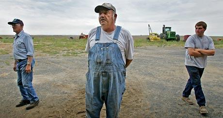 (Ken Lambert ) Three generations of Washtucna wheat farmers, from left: Lester Snyder, 84; his son Jerry Snyder, 55; and Jerry's son Jason Snyder, 22. President Bush 'comes across as someone who wants to help us,' says Lester Snyder, who thinks the president deserves more support.