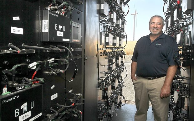 (Bob Brawdy photo)John Steigers, a project developer for Energy Northwest, stands inside a portable shipping container filled with batteries that are part of an intelligent storage system currently being tested at the Nine Canyon Wind Project south of Kennewick.